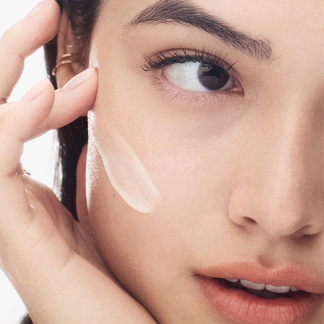 Model removing makeup with our gentle yet powerful Soothing Cleansing Oil